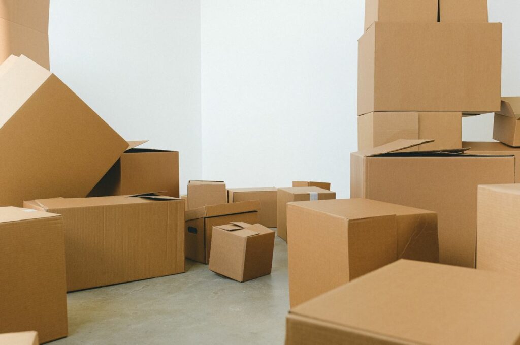 Cardboard boxes in a white room