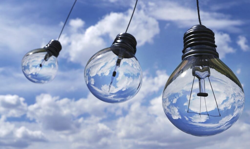 Light bulbs hanging against a blue sky