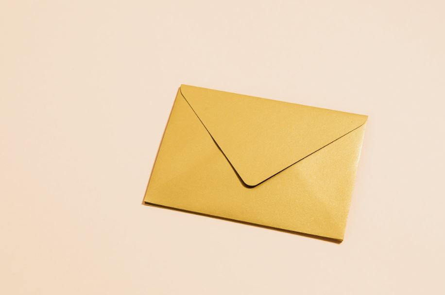 A closed, golden envelope
